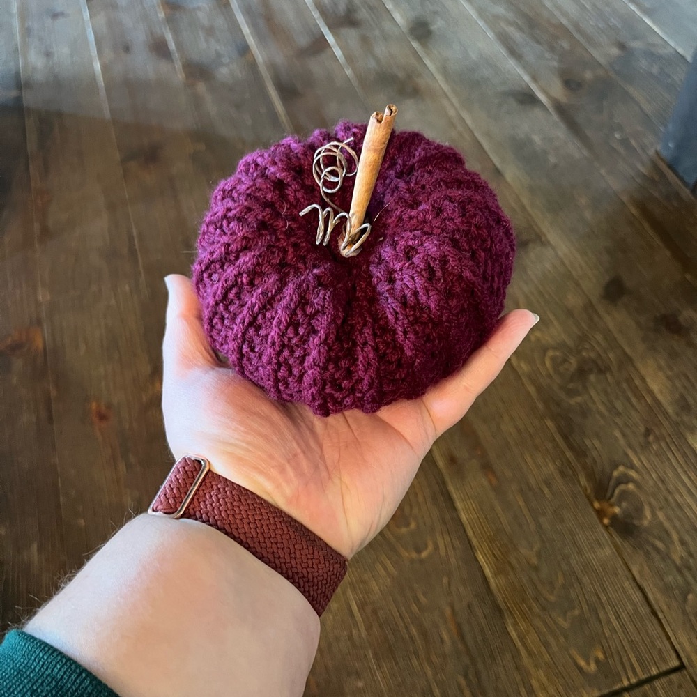 Mini handmade crochet pumpkin with cinnamon stick “stem”